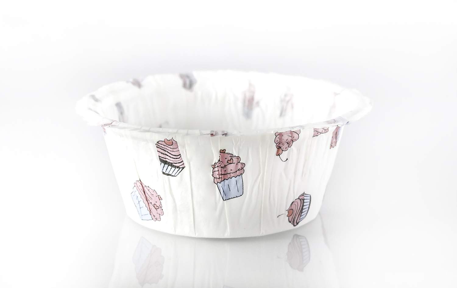 White muffin cup with pink and blue muffins design