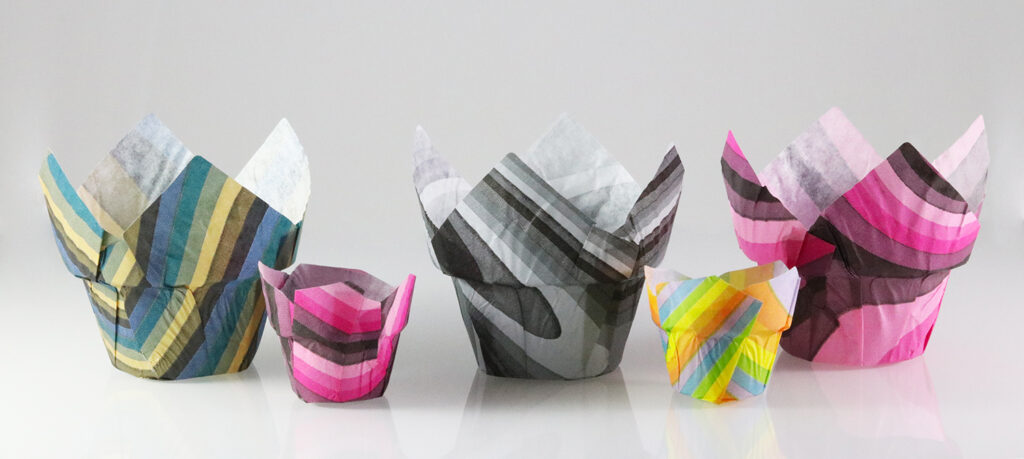 five patterned muffin wraps of various sizes