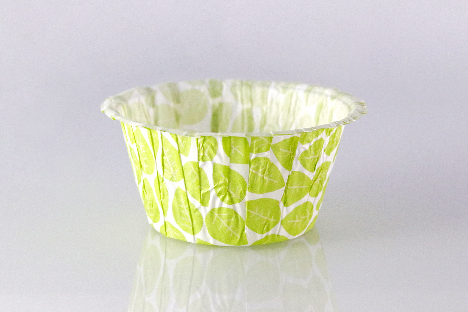 White and green muffin cup with leaf pattern